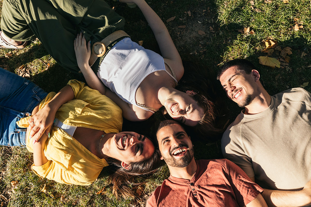 friends laying in grass